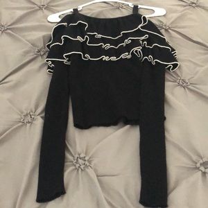 Black ruffled sweater top.